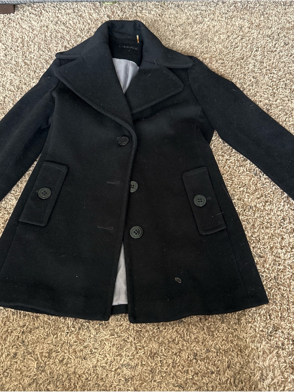 Calvin Klein Black Wool it does have stains inside the coat.